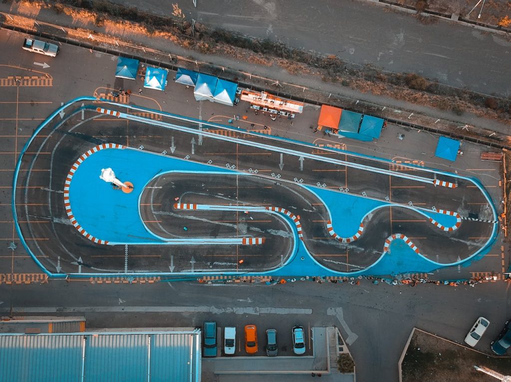 Top-down aerial shot of a racetrack in Mendoza, Argentina showcasing urban layout and vibrant colors.